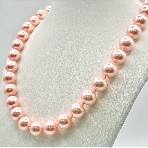 463 - A Metallic Pink South Sea Pearl Shell Bead Necklace. 12mm beads. 55cm necklace length.