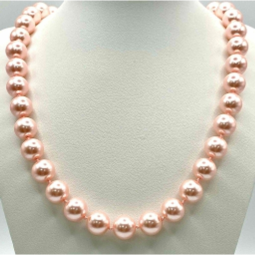 463 - A Metallic Pink South Sea Pearl Shell Bead Necklace. 12mm beads. 55cm necklace length.