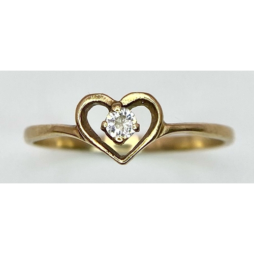 465 - A 9 K yellow gold ring with a cubic zirconium enclosed in a heart. Size: N, weight:  0.9 g.