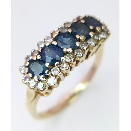 466 - A 9K YELLOW GOLD DIAMOND & SAPPHIRE RING. 2.7G. SIZE M.