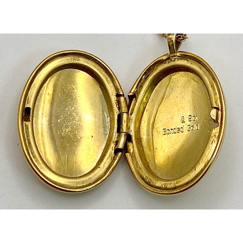 486 - A 9 K yellow gold chain necklace with a locket carrying the inscription 