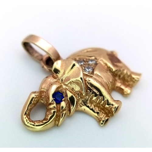 795 - A 9K YELLOW GOLD STONE SET ELEPHANT CHARM. 2.4G