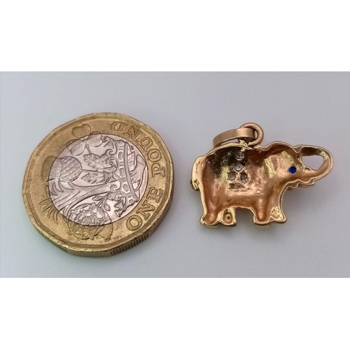 795 - A 9K YELLOW GOLD STONE SET ELEPHANT CHARM. 2.4G