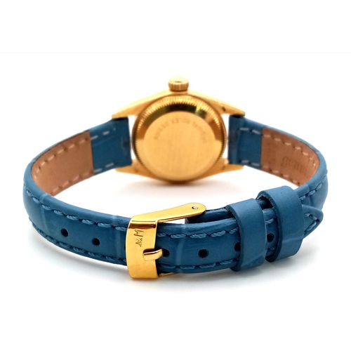 934 - An 18k Gold Rolex Oyster Perpetual Ladies Watch. Blue leather strap. 18k gold case - 25mm. Gold tone... 