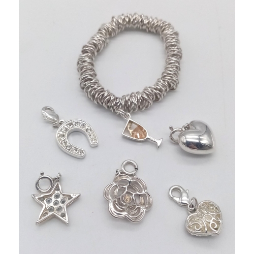 843 - Five Silver Charms and a Silver 'Sweetie' Style Bracelet. 41g total weight.