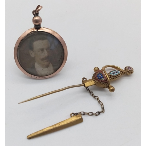 941 - Two Antique Yellow Metal Pendants - Enamel sword (7cm) and photo - 3cm.