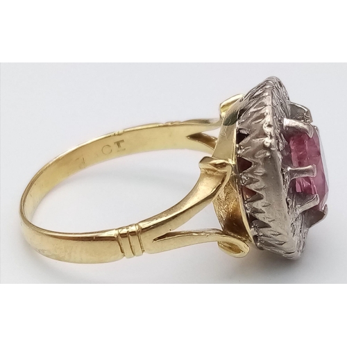 1104 - A NATURAL BURMESE RUBY SURROUNDED BY DIAMONDS AND SET IN 18K GOLD .  6.8gms   size Q