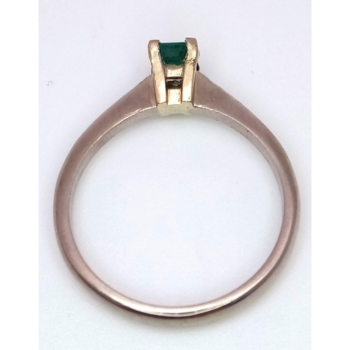 1237 - An 18K White Gold and Emerald Solitaire Ring. Size N. 2.8g total weight.