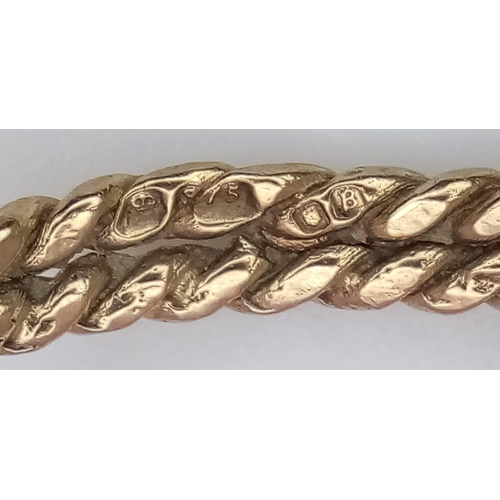 1253 - A 9K YELLOW GOLD LUCKY KNOT RING. 1.7G. SIZE L