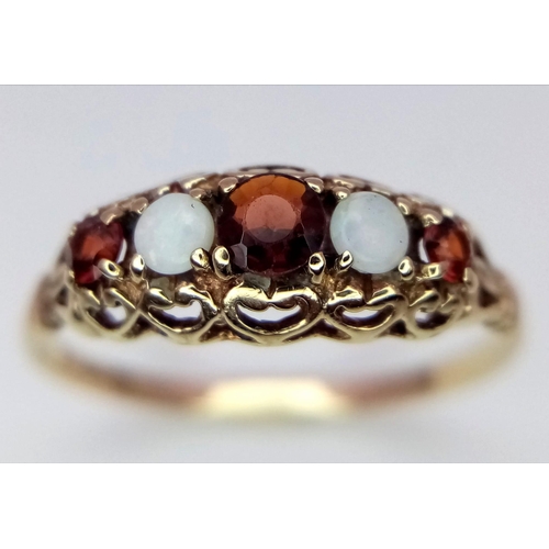 1412 - A 9K YELLOW GOLD GARNET & OPAL RING. 1.3G. SIZE M.