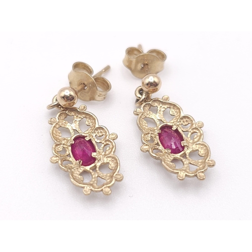 361 - Two antique pairs of 9 K yellow gold earrings, one with oval cut rubies the other one with marquise ... 