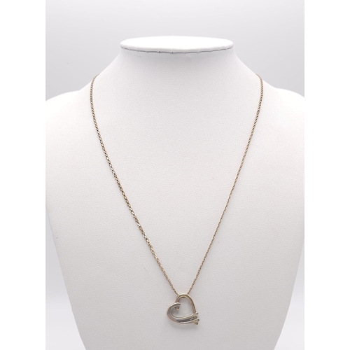 429 - A 9 L yellow gold chain necklace with a heart pendant decorated with a single diamond. Chain length:... 