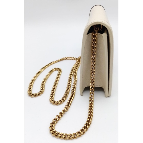 485 - A Gucci Diana Mini Bag. Cream leather exterior with bamboo and gold tone monogram and chain shoulder... 