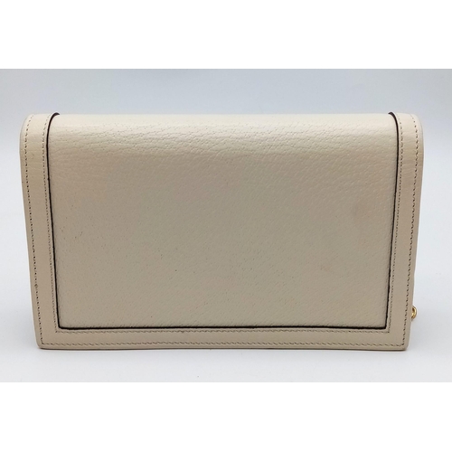 485 - A Gucci Diana Mini Bag. Cream leather exterior with bamboo and gold tone monogram and chain shoulder... 