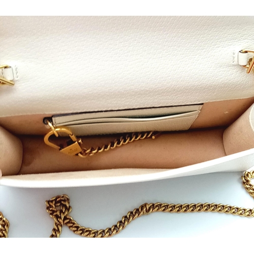 485 - A Gucci Diana Mini Bag. Cream leather exterior with bamboo and gold tone monogram and chain shoulder... 