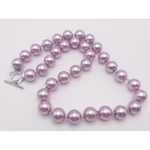 722 - A Metallic Lavender South Sea Pearl Shell Bead Necklace. 12mm beads. 45cm necklace length.