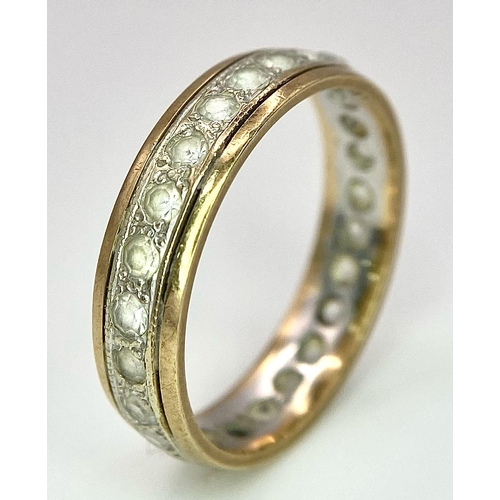 796 - A 9 K yellow gold, stone set, eternity ring. One stone missing. Size: O, weight: 2.7 g.