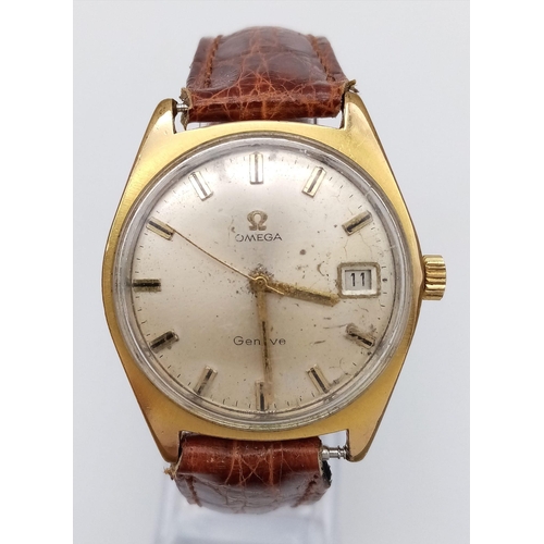 802 - A Vintage Omega Geneve. Brown crocodile strap. Gilded case - 35mm. Gold tone dial with date window a... 