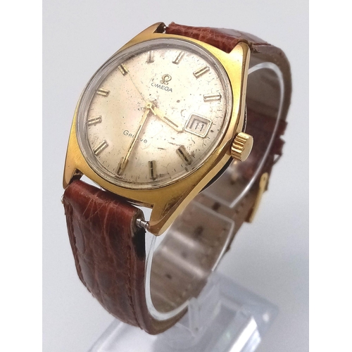 802 - A Vintage Omega Geneve. Brown crocodile strap. Gilded case - 35mm. Gold tone dial with date window a... 