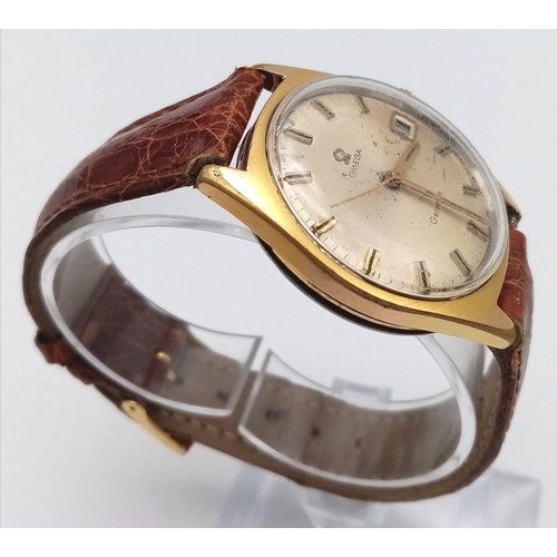 802 - A Vintage Omega Geneve. Brown crocodile strap. Gilded case - 35mm. Gold tone dial with date window a... 