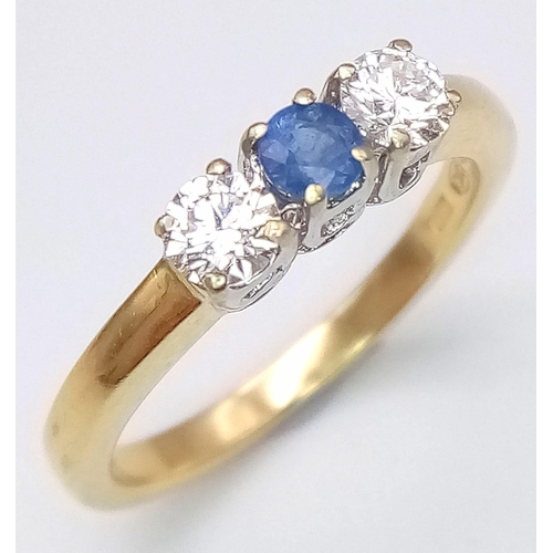 825 - An 18K Yellow Gold, Diamond and Sapphire Ring. Central 0.20ct sapphire with a 0.20ct brilliant round... 