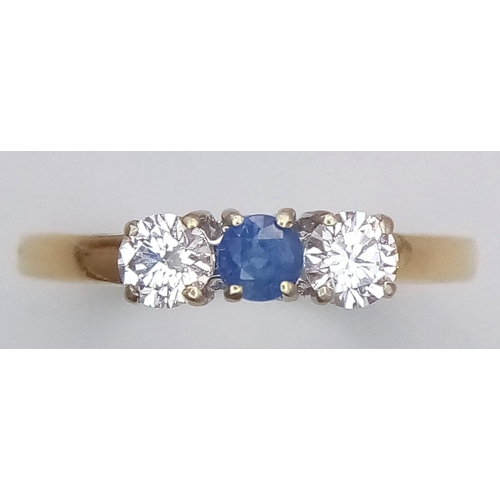 825 - An 18K Yellow Gold, Diamond and Sapphire Ring. Central 0.20ct sapphire with a 0.20ct brilliant round... 