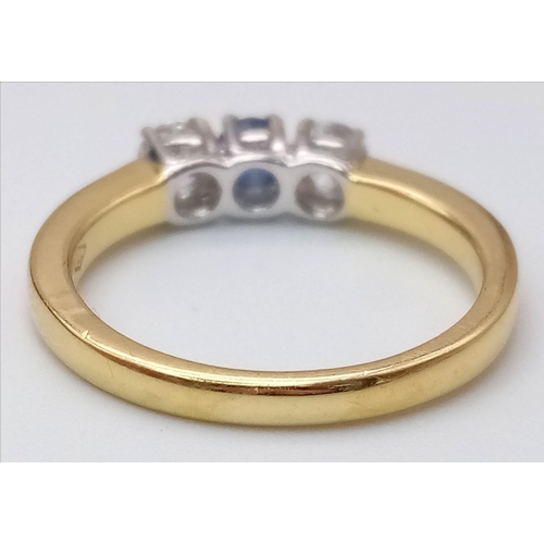 825 - An 18K Yellow Gold, Diamond and Sapphire Ring. Central 0.20ct sapphire with a 0.20ct brilliant round... 