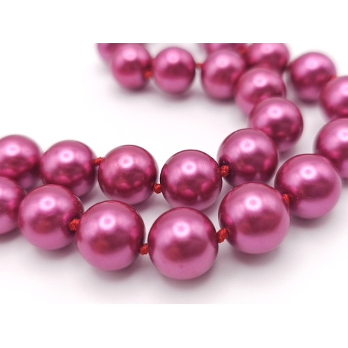 919 - A Metallic Burgundy South Sea Pearl Shell Bead Necklace. 12mm beads. 44cm necklace length.