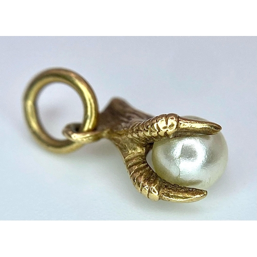 963 - A 9K Yellow Gold, Eagle Claw and Pearl Pendant/charm. 0.91g total weight.