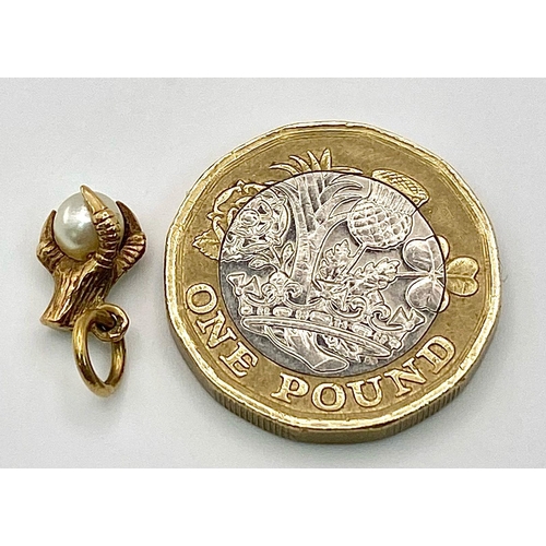 963 - A 9K Yellow Gold, Eagle Claw and Pearl Pendant/charm. 0.91g total weight.