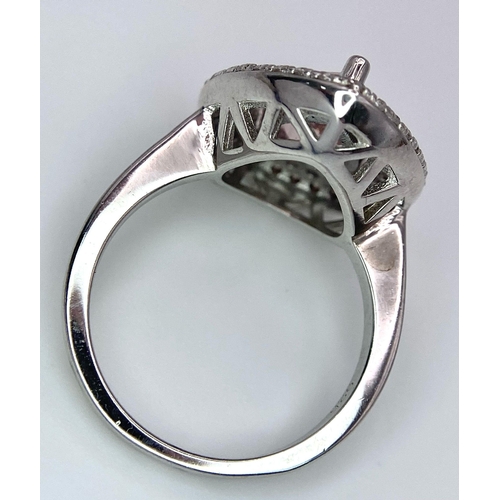 977 - A STERLING SILVER STONE SET COCKTAIL RING. 4.5G SIZE K