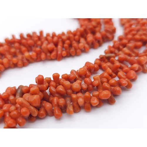 1190 - Three Strand Orange Coral Necklace. 
Measuring 42cm in length, this bold necklace is a bright access... 