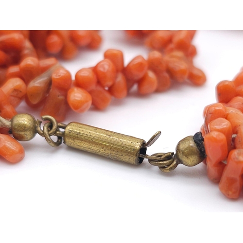 1190 - Three Strand Orange Coral Necklace. 
Measuring 42cm in length, this bold necklace is a bright access... 