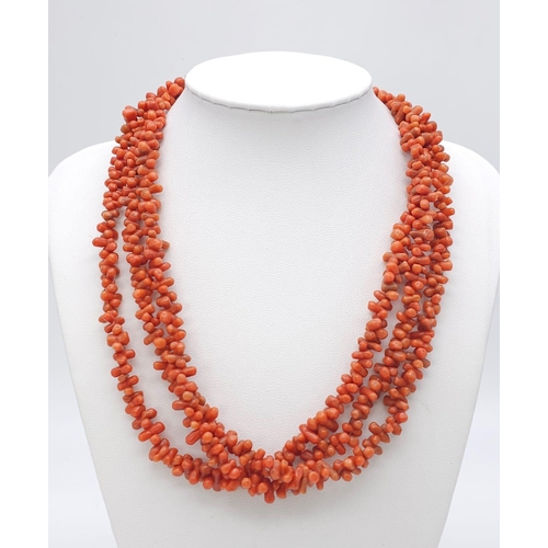 1190 - Three Strand Orange Coral Necklace. 
Measuring 42cm in length, this bold necklace is a bright access... 