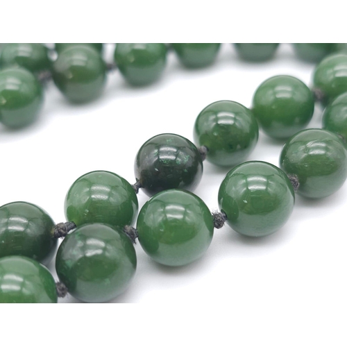 1131 - Long Green Jade Beaded Necklace.
Measuring 68cm in length, this necklace is filled with rich green r... 