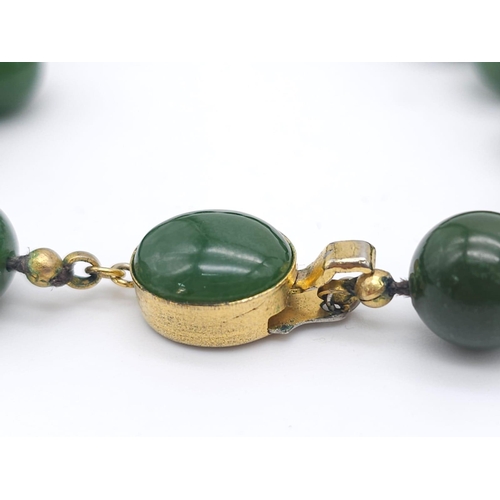 1131 - Long Green Jade Beaded Necklace.
Measuring 68cm in length, this necklace is filled with rich green r... 