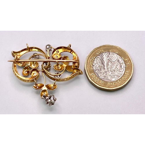 1063 - An Antique 18K Gold and Diamond Decorative Foilage Swirl Brooch/Pendant. 3.5cm x 3cm. 6.67g total we... 