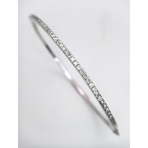 131 - Superb 18kt White Gold, Diamond Set Bangle.
With a safety, hinge release this beautiful bangle measu... 