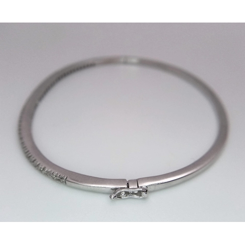 131 - Superb 18kt White Gold, Diamond Set Bangle.
With a safety, hinge release this beautiful bangle measu... 