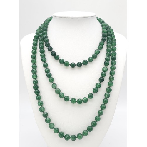 229 - A superb, long beaded Jade necklace.
Measuring 124 cm in length, with rich, deep, mesmerising greens... 