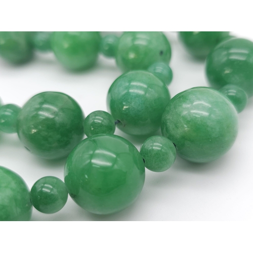 775 - An exquisite large Jade Beaded Necklace.
A mixture of big and small brightly coloured Jade rounded s... 