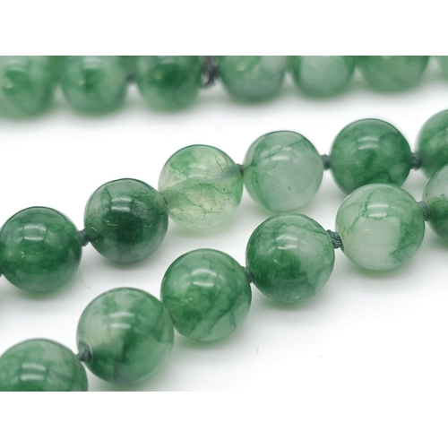 187 - Long Beaded Jade Necklace.
Lovely white and green colours coming through each rounded Jade stone on ... 