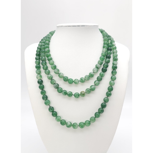 187 - Long Beaded Jade Necklace.
Lovely white and green colours coming through each rounded Jade stone on ... 