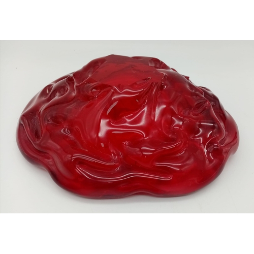 1055 - A HEAVY RED GLASS ASHTRAY CICA 1960'S  POSSIBLY MURANO .  18cms DIAMETER