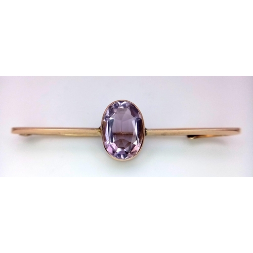 1110 - A 7ct KUNZITE STONE SET IN ANTIQUE ROSE GOLD BAR BROOCH SETTING .4.7gms