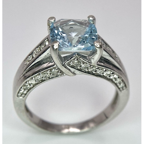 1116 - A FABULOUS AQUAMARINE AND DIAMOND RING SET IN 14K WHITE GOLD .   5.4gms   size M