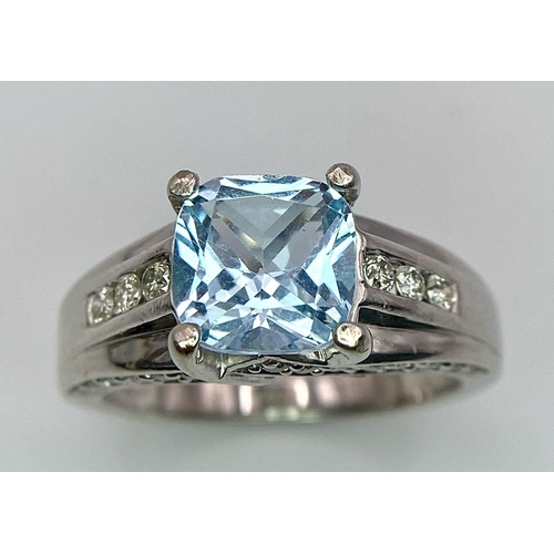 1116 - A FABULOUS AQUAMARINE AND DIAMOND RING SET IN 14K WHITE GOLD .   5.4gms   size M