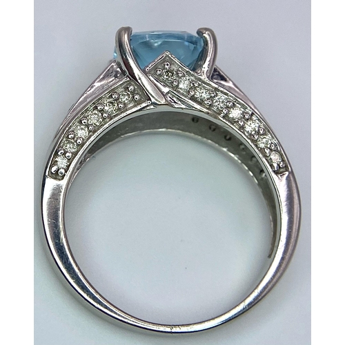 1116 - A FABULOUS AQUAMARINE AND DIAMOND RING SET IN 14K WHITE GOLD .   5.4gms   size M