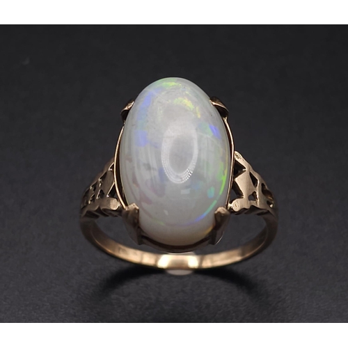 1118 - A LARGE VINTAGE OPAL CABOCHON RING IN 9K GOLD.    3.4gms   size P