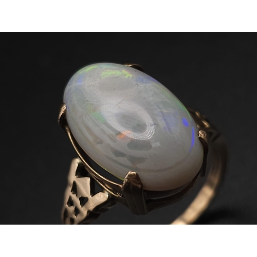 1118 - A LARGE VINTAGE OPAL CABOCHON RING IN 9K GOLD.    3.4gms   size P